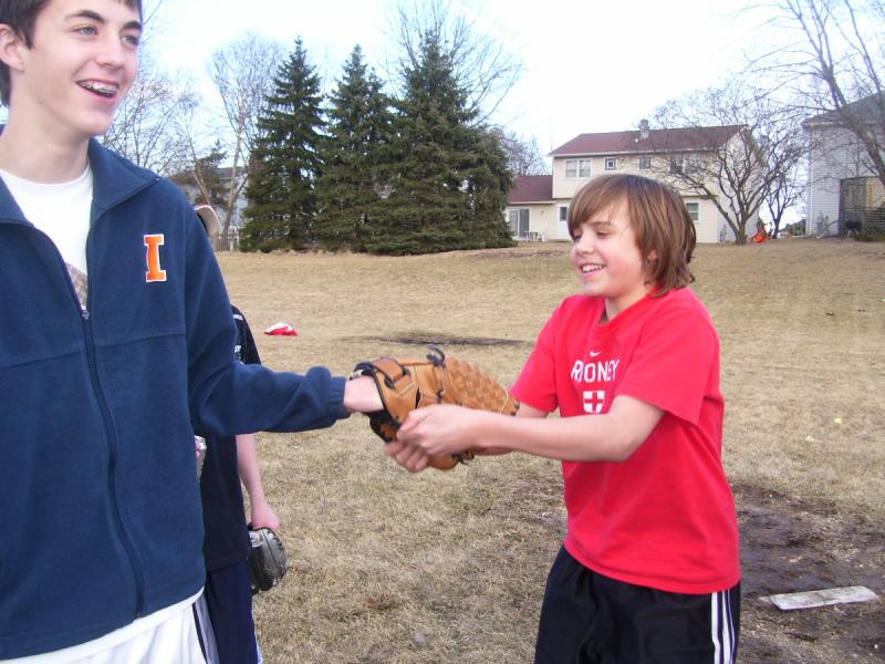 Michael is stealing the mitt right off of dereks hand.